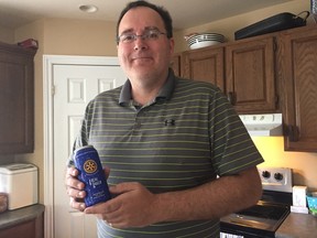 Wade Coombs, president of the St. Thomas Railway City Rotary Club, holds a can of Rotary Local Lager. Sales from the beer will benefit Rotary International and local Rotary Club projects. (Laura Broadley/Times-Journal)