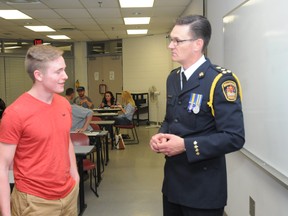 Evan Court, who is among the recent graduates of Brantford police's 20th annual Citizens Police Academy, talks with Chief Geoff Nelson. (Submitted Photo)