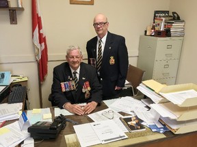 Merrill Gooderham, president of the Royal Canadian Legion Branch 560, seated, and branch public relations officer Chuck D’Aoust say the branch's financial state is critical after a loss of hall rental income and increased costs in Kingston. Elliot Ferguson/The Whig-Standard/Postmedia Network