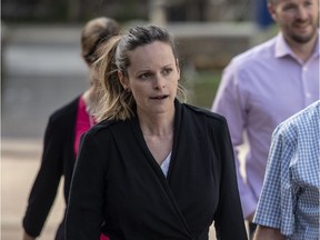 Kyla Cowan-Wilson, left in black, arrives to the Ottawa Courthouse Friday, May 18, 2018, where is expected to plead guilty to charges of sexual assault, invitation to sexual touching and sexual interference in relation to incidents that occurred over the course of a year (2013-2014) when she was a teacher in the Ottawa District School Board. (Darren Brown/Postmedia)