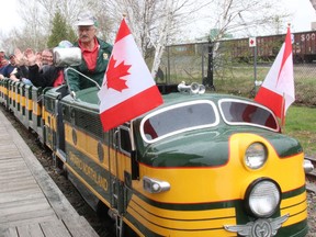 Elfio Cappadocia drives the North Bay Heritage Railway and Carousel Company's new diesel train professionally painted by Ontario Northland using its original green and yellow colour scheme, Saturday. Dave Dale / The Nugget