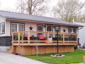 Norfolk County has flagged the new deck on the front of this cottage at 26 Ferris St. in Turkey Point. The property was the subject of a staff report and discussion at last week’s meeting of Norfolk council.    MONTE SONNENBERG / SIMCOE REFORMER