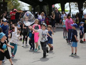 Kids chase bubbles at Lake Ontario Park. Hundreds of people were out in force to enjoy the sunny Victoria Day weekend and special activities hosted by the City of Kingston on Sunday, May 20, 2018.