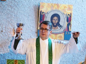 Rev. Robert Derrenbacker, president of Thorneloe University, presides over the weekly worship service in the Anglican tradition in November 2017. (Gino Donato/Sudbury Star file photo)