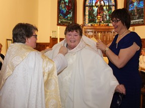Rev. Belair was vested  by her daughter Karen Belair Girard and Archdeacon Deborah Lonergan-Freake.