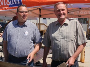 Nipissing NDP candidate Henri Giroux and Timiskaming Cochrane candidate John Vanthof cook up burgers Tuesday for workers at the ONTC shops in North Bay.
PJ Wilson/The Nugget