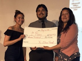 Brooke and Hunter Fisher took top prize for their presentation on Chuck's on Dufferin, at the Glass Panel event held at the Wallaceburg Museum held on Wednesday, May 16, 2018. Presenting the award is Wallaceburg District Secondary School teacher Zhahwun Shognosh, right.