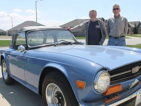 Bluewater Austin-Healey Club members Mike Widdowson and Dave Gildner stand beside Widdowson's British sports car, his Triumph TR6.
CARL HNATYSHYN/SARNIA THIS WEEK