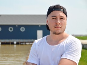 Juan Castro stands on a dock at Port Stanley, near where he and his father ran their jet ski company last summer. Despite what Castro called a "very successful year" in 2017 he and his company will not return this year, after Central Elgin council heard liability insurance would be too expensive. (Louis Pin/Times-Journal)