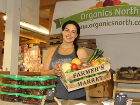 FILE PHOTO
Angelina Morris holds up organic produce at the Grande Prairie Farmers Market in 2015. The Town of Sexsmith is expecting to open a farmers’ market on June 19.