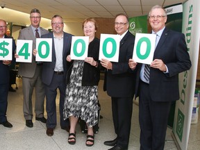 Desjardins donated $40,000 to the therapeutic/leisure pool fundraising campaign at the Lionel E. Lalonde Centre on Tuesday. From left are Mayor Brian Bigger, Paul Mayer, director of Desjardins, Caisse populaire vallee est,  Richard Dupuis, director, Desjardins Business Centre, Ward 4, Coun. Evelyn Dutrisac, Jean-Marc Spencer, executive director Voyageur Credit Union Caisse populaire, and Jean Bisson, director of the Caisse populaire Vermillon. Gino Donato/Sudbury Star/Postmedia Network