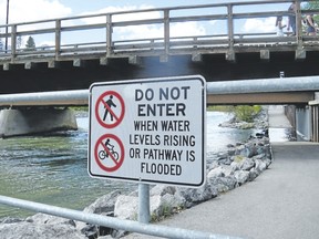 The Bow River bridge pathway in Canmore is closed Monday due to the river’s rise.