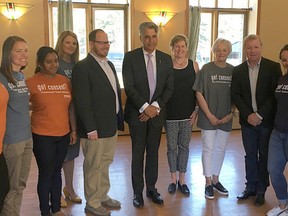 Minister Sabir and MLA Cameron Westhead speak with participants and staff at the Banff YWCA on Tuesday, May 22, 2018.