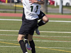 Giovanni Ausman leaps into the arms of St. John's College teammate Noah DeDominicis after scoring Wednesday in the Brant County high school boys soccer championship game at the Bisons Alumni North Park Sports Complex in Brantford. (Brian Thompson/The Expositor)