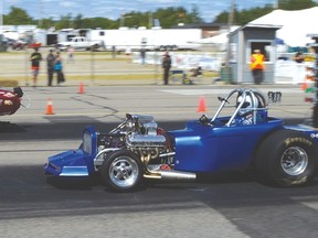 File photo
Two competitors raced dowjn the track at last year’s North Shore Drag Races at the