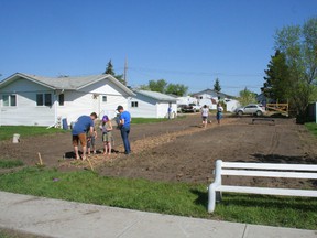 Fairview's Community Garden officially opened May 19 and a few volunteers were out marking individual plots with string and stakes. Stan Golob said 12 plots have been taken, leaving about 8-10 more. Forms are available at the town office, plots are on a first-come, first pay basis.