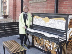 KEVIN RUSHWORTH HIGH RIVER TIMES/POSTMEDIA NETWORK. Artist Barb Chaput was selected by representatives with the Community Piano to paint the instrument. The finished design was unveiled outside Carlson's on Macleod on May 18.