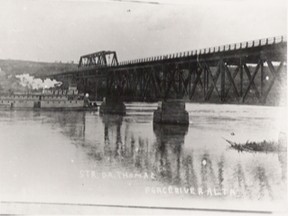 80.1123.019 – It’s a sight many have seen in photographs, but relatively few in reality, as the 1916 sternwheeler D. A. Thomas, with her hinged stacks, passes under the 1918 Million-dollar Bridge on her way to the Vermilion Chutes a year after the bridge’s completion.