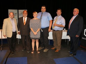 Moderator Cheryl St. Amour of Timmins, centre, kept the discussion on track during the Timmins riding all-candidates debate held Wednesday night at O’Gorman High School. Candidates were, Yvan Génier, left, Gilles Bisson, Gary Schaap, Josef Bauer and Mickey Auger. The event was hosted by the Timmins Chamber of Commerce.