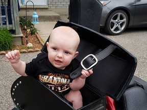 Columnist Kimberlee Taplay introduces her granddaughter, Isabelle, to her motorcycle, Ruby. (Submitted Photo)