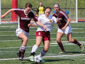 Regiopolis Notre-Dame Panthers’ Kaleigh Coco keeps the ball moving away from Frontenac Falcons’ Emma Young during the first half of the Kingston Area Secondary Schools Athletic Association senior girls soccer final at Richardson Stadium on Thursday. The Panthers won the game, 2-0. (Julia McKay/The Whig-Standard)