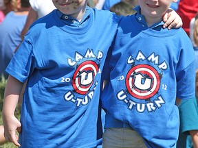 Twins Carter Vanderzwart, left, and Carson Vanderzwart, then 5, at Camp U-Turn in 2012. The Wallaceburg summer camp program has been denied funding this year because organizers wouldn’t agree with a federally-mandated attestation in the application form that it believed contradicts its Christian principles. (David Gough/Postmedia Network)