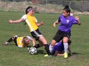 Trista Boulette (right) of the Beaver Brae Broncos battles a Fort Frances Muskies player for the ball as their respective teammates, Muskies Cali Lappage and Broncos Gracie Kantola, take tumbles, as the teams played to a 0-0 draw in the final NorWOSSA 'AA' girls soccer match of the regular season, Wednesday, May 23 at Tom Nabb Soccer Park. SHERI LAMB/Daily Miner and News/Postmedia Network