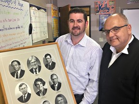Brad Stark (left), executive director of St. Leonard’s Community Services, and board president Larry Brock pose with a display of the agency’s early directors. (Vincent Ball/The Expositor)