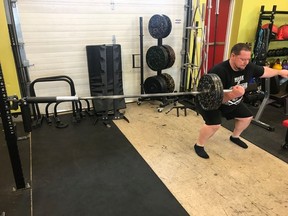 Jan Murphy performs a landmine single-arm zercher squat during his training at 247 Fitness under the tutelage of Visionary Fitness owner Farr Ramsahoye.  (Farr Ramsahoye/Visionary Fitness)