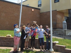 Photo by KEVIN McSHEFFREY/THE STANDARD
Elliot Lake Pride committee president Chantal Vaillancourt and Mayor Dan Marchisella (far right) raise the rainbow flag at city hall on Friday afternoon. The were joined by committee vice-president Doug Elliott, AMK MP Carol Hughes, along with the 2018 Pride emperor and empress of Algoma Corey Doughty and Tyrina Cyr.