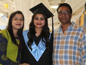 Musarat Shaikh, an international student from India, is embraced by her mother Shahin and father Shiraj, shortly before the graduation ceremony at Northern College’s Timmins campus Friday afternoon. Her parents travelled from India to see their daughter receive her diploma in early childhood education.