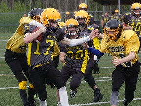 Riley Lavergne (17), of the North Bay Bulldogs junior varsity, was a force to reckon with as the home side edged the TNT Express 27-26 at the Steve Omischl Sports Fields Complex, Saturday, to improve their Ontario Provincial Football League record to 1-1. Dave Dale / The Nugget