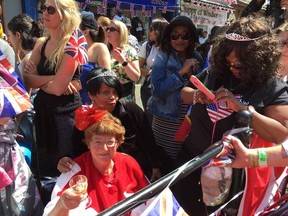 PHOTO SUBMITTED
Bernadette Christie (in red) celebrates the wedding of Prince Harry and Meghan Markle with other Royal Family fans in Windsor on Saturday, May 19.