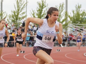 Kingston Blues’ Anna Workman finishes first in 58:61 in the junior girls 400-metre race at the Eastern Ontario Secondary Schools Athletic Association track and field meet at CaraCo Home Field in Kingston on Friday. (Julia McKay/The Whig-Standard/Postmedia Network)
