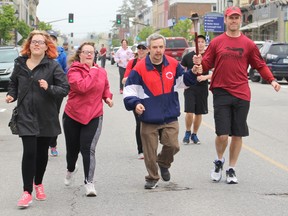 The Special Olympics Torch Run came to the streets of Kincardine accompanied and led by the Ontario Provincial Police on Tuesday May 22, 2018.  The torch run helps raise funds to send the Special Olympic Athletes to the summer games. (Ryan Berry/ Kincardine News and Lucknow Sentinel)