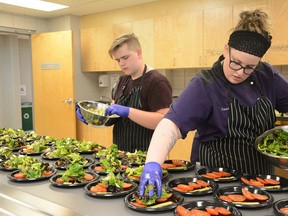 Hilltop students prepare tomato mozzarella salad for the Charity Luncheon on May 23 (Peter Shokeir | Whitecourt Star).