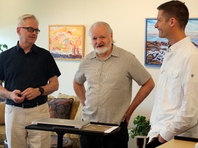 Christian Fortin, left, Dermot Wilson and Richard Fortin talk about the inaugural exhibition of the Northern Ontario Visual Arts Hive, Monday, part of a new "innovation and co-working hub" at the former Tweedsmuir Public School. PJ Wilson/The Nugget