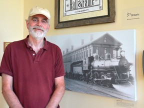 Laurence Grant, a historian with the North America Railway Hall of Fame, stands inside the hall on the second floor of the CASO Station in St. Thomas. The group will host their biennial induction ceremony June 15 inside the old train station. (Louis Pin/Times-Journal)