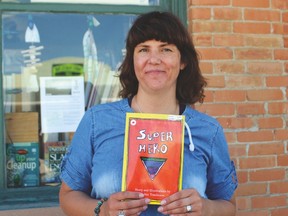 Robin Tomlinson holds up the children’s book she has written and illustrated, called Super Hero. Stephen Tipper Nanton News