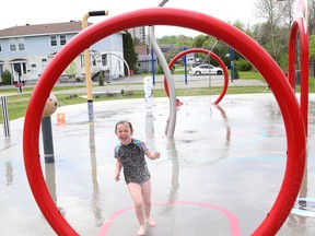 Yevette Beacler, 5, cools off at the splash pad at the DJ Hancock Memorial Park on Monday. (John Lappa/Sudbury Star)