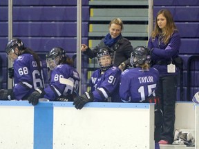 Woodstock's Kelly Paton, third from the right, talks to a player coming off the ice during a Western University Mustangs game. Paton was named the head coach and manager of hockey operations for Wilfrid Laurier's women's hockey team following two successful years as Western's head coach. Greg Colgan/Woodstock Sentinel-Review/Postmedia Network