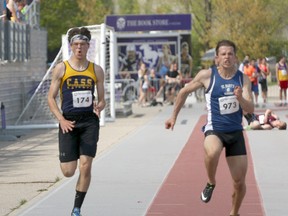 College Avenue's Mathew Musclow, left, and St. Mary's Daniel Demelo-Knapp run in the senior boys' 100m dash in London, Ont. during the TVRA Central track and field meet on Wednesday May 16, 2018 at TD Stadium at Western University. The second day continues today with WOSSAA track and field finals May 24 and 25. Greg Colgan/Woodstock Sentinel-Review/Postmedia Network