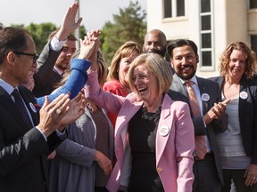 Premier Rachel Notley is applauded at a press conference after speaking about the Kinder Morgan pipeline project, in Edmonton on Tuesday, May 29, 2018.THE CANADIAN PRESS/Jason Franson