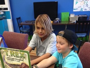 Reading buddies at the Boys and Girls Club of Kingston. Supplied photo.