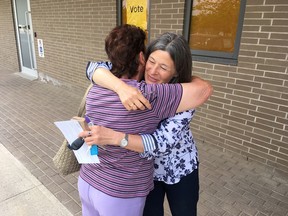 Liberal incumbent candidate Sophie Kiwala hugs a supporter outside of an advanced polling station in Kingston, Ont. on Monday, May 28, 2018. 
Elliot Ferguson/The Whig-Standard/Postmedia Network