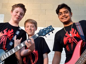 Mason Otte, Adam H. T. Swallowell, and Dinith Nawaratne stand outside the Music Box, an east end banquet hall where they practice. The young band is quietly amassing a following in London, winning last year’s London’s Got Talent and the more-recent Jack Richardson High School Battle of the Bands. LOUIS PIN/Postmedia News