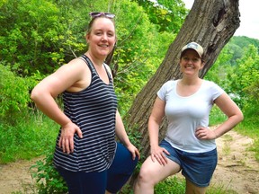Elizabeth “Bizz” Varty (left) and Nina Sampson stand in Springbank Park where they led a group of people on the first of a series of nature walks with the Centre of Movement Arts. The walks combine physical activity and indigenous plants and species. (Louis Pin/Postmedia News)
