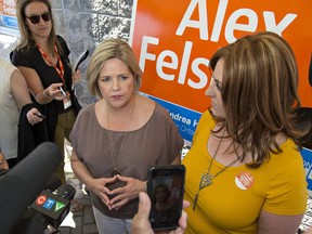 Brian Thompson/The Expositor
Brantford-Brant NDP candidate Alex Felsky (right) listens as Ontario NDP leader Andrea Horwath responds to questions from media during a campaign stop on Tuesday in Brantford.