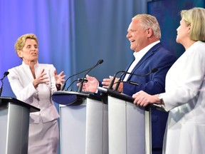 Ontario Liberal Leader Kathleen Wynne, left to right, Ontario Progressive Conservative Leader Doug Ford and Ontario NDP Leader Andrea Horwath participate during the third and final televised debate of the provincial election campaign in Toronto on May 27. THE CANADIAN PRESS/Frank Gunn