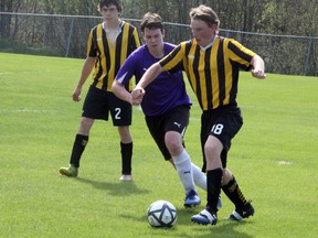 The Fort Frances Muskies proved to much for Andrew Carmichael (middle) and the Beaver Brae Broncos boys soccer team, as they fell 3-0 at Tom Nabb Soccer Park, Wednesday, May 23 in the final regular season NorWOSSA 'AA' action of the year. The Broncos remain winless as they head to the NorWOSSA 'AA' championship May 30 in Fort Frances. SHERI LAMB/Daily Miner and News/Postmedia Network
